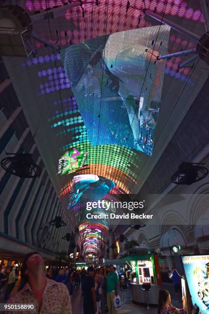 People watch as the Fremont Street Experience pays tribute to Swedish DJ/producer and former Las Vegas headliner Avicii with a photo retrospective on...