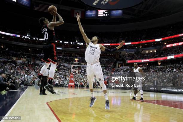 DeMar DeRozan of the Toronto Raptors puts up a shot in front of Otto Porter Jr. #22 of the Washington Wizards in the first half during Game Four of...