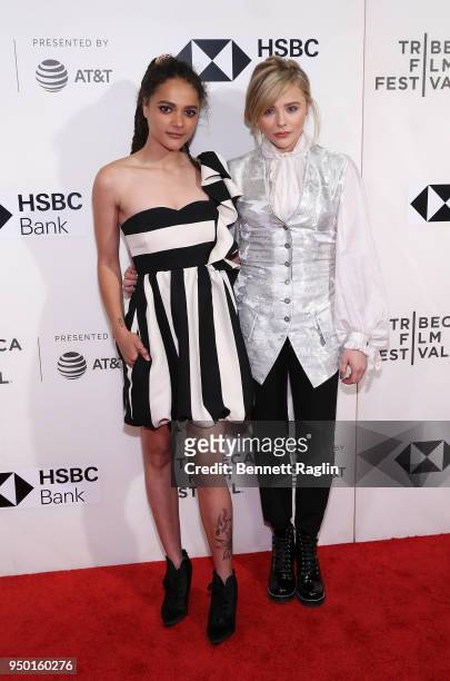 Actors Sasha Lane and Chloe Grace Moretz pose for a picture on the red carpet during the 2018 Tribeca Film Festival screening of "The Miseducation Of...