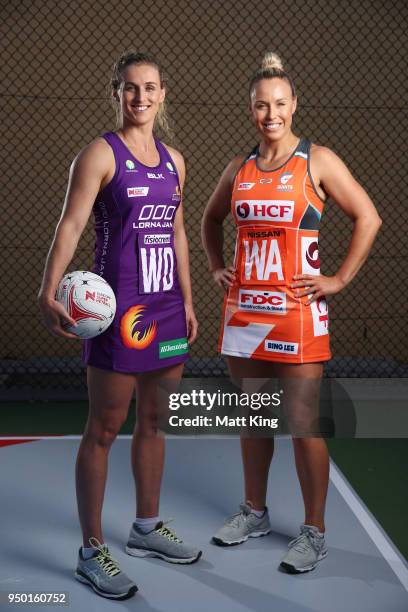 Gabi Simpson of the Queensland Firebirds and Kimberlee Green of Giants Netball pose during the Suncorp Super Netball 2018 season launch on April 23,...