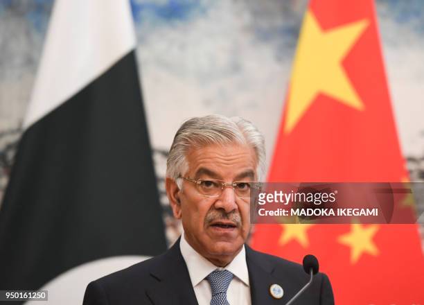Pakistans Foreign Minister Khawaja Muhammad Asif speaks during his press conference with Chinese State Councilor and Foreign Minister Wang Yi at the...