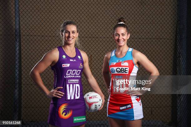 Gabi Simpson of the Queensland Firebirds and Abbey McCulloch of the NSW Swifts pose during the Suncorp Super Netball 2018 season launch on April 23,...