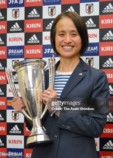 Head coach Asako Takakura of Japan poses for photographs during a press conference on arrival at Narita International Airport on April 22, 2018 in...