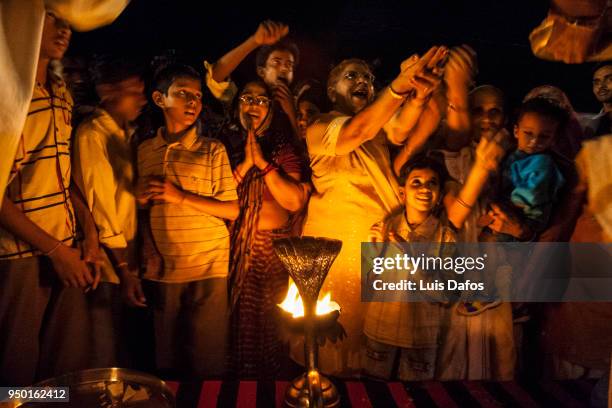 believers gather for ganga aarti blesing. - ganga ghat stock pictures, royalty-free photos & images