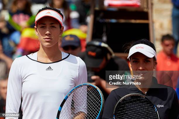 Garbine Muguruza of Spain poses with Veronica Cepede Royg of Paraguay prior to their game during day two of the Fedcup World Group II Play-offs match...