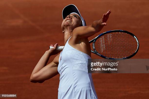 Veronica Cepede Royg of Paraguay serves in her match against Garbine Muguruza of Spain during day two of the Fedcup World Group II Play-offs match...