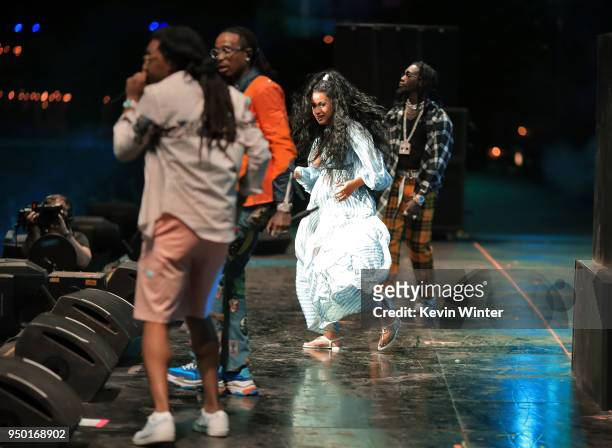 Cardi B performs with Takeoff, Quavo, and Offset of Migos onstage during the 2018 Coachella Valley Music And Arts Festival at the Empire Polo Field...