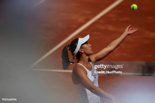 Veronica Cepede Royg of Paraguay serves in her match against Garbine Muguruza of Spain during day two of the Fedcup World Group II Play-offs match...