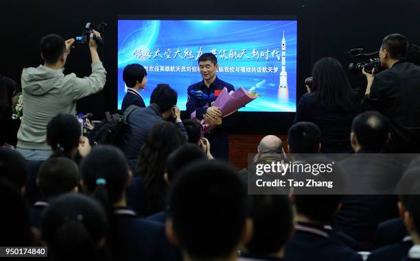 Chinese astronauts Liu Boming talks with students during Chinese astronauts Liu Boming visit to Harbin to celebrate China Space Day at The High...
