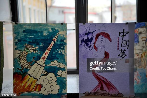 Students drawing a pinting of Chinese astronauts space shuttle to celebrate the 3rd Space Day at The High school Attached to Harbin Institute of...