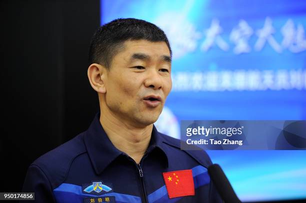 Chinese astronauts Liu Boming talks with students during Chinese astronauts Liu Boming visit to Harbin to celebrate China Space Day at The High...