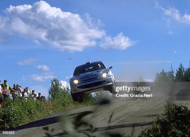 Francois Delecour of France driving the Peugeot 206 WRC during the FIA World Rally Championship round 9 Finnish Rally at Jyvaskyla in Finland. \...