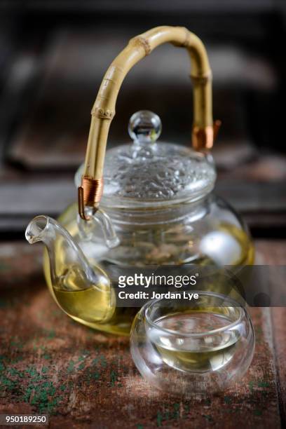 teapot serve with green tea - oregano ストックフォトと画像