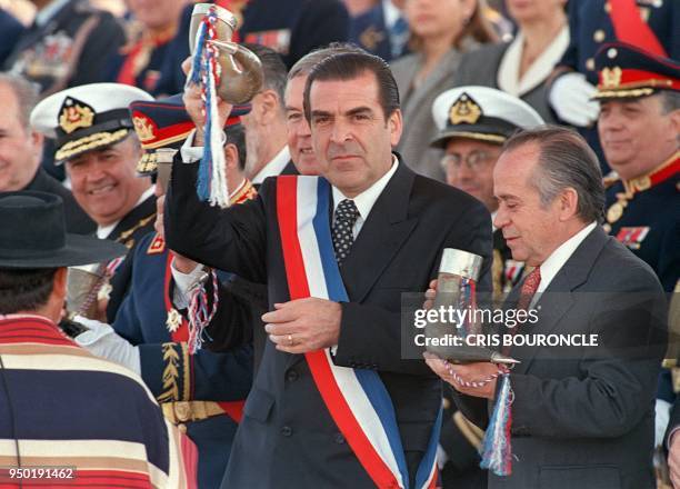 Chilean President Eduardo Frei makes a toast in a traditional horn "Cacho de Chicha" at the beginning of the military parade in Santiago, 19...