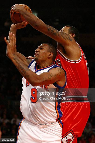 Jonathan Bender of the New York Knicks is blocked by James Johnson of the Chicago Bulls at Madison Square Garden on December 22, 2009 in New York...