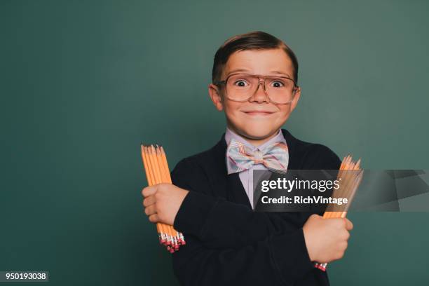 young nerd boy with cheesy grin - teachers pet stock pictures, royalty-free photos & images