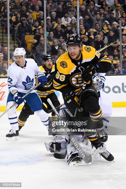 David Pastrnak of the Boston Bruins skates for the puck against the Toronto Maple Leafs during the First Round of the 2018 Stanley Cup Playoffs at...