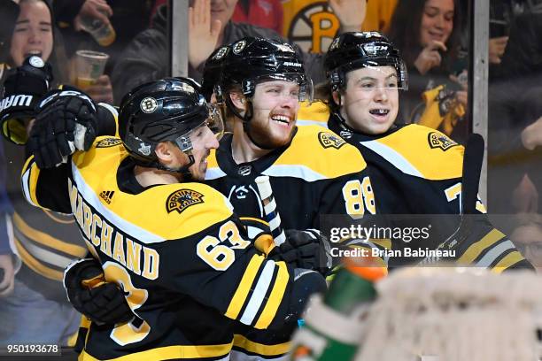 Brad Marchand, David Pastrnak and Charlie McAvoy of the Boston Bruins celebrate a goal against the Toronto Maple Leafs during the First Round of the...