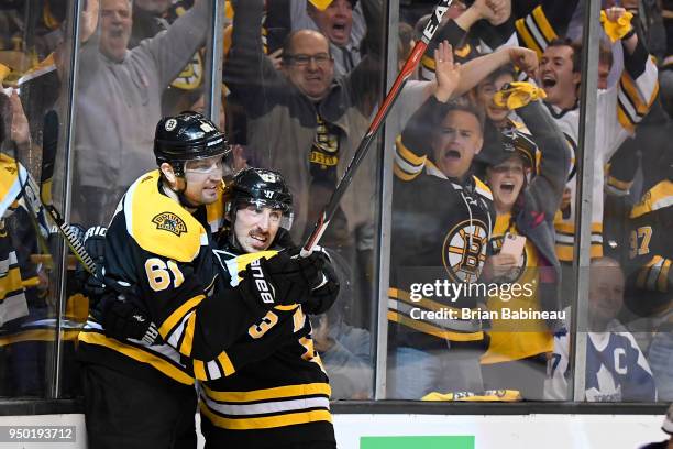 Rick Nash and Brad Marchand of the Boston Bruins celebrate a goal against the Toronto Maple Leafs during the First Round of the 2018 Stanley Cup...