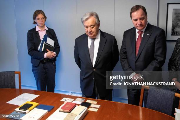 Secretary General António Guterres and Swedish Prime Minister Stefan Lofven look at the Dag Hammarskjold Collection ahead of deliberations at the...