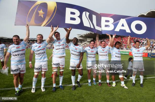 Dan Carter of Racing 92 and teammates hold a billboard 'Bilbao' to celebrate their qualification for the final in Bilbao following the EPCR European...
