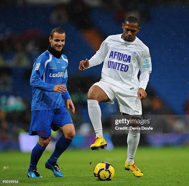 Franck Songo'o of Africa United controls the ball beside Roberto Soldado of the Spanish La Liga Selection during a charity match between Africa...