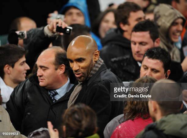 Frederic Kanoute is greeted by fans after the charity match between Africa United and the La Liga Selection at the Santiago Bernabeu stadium on...