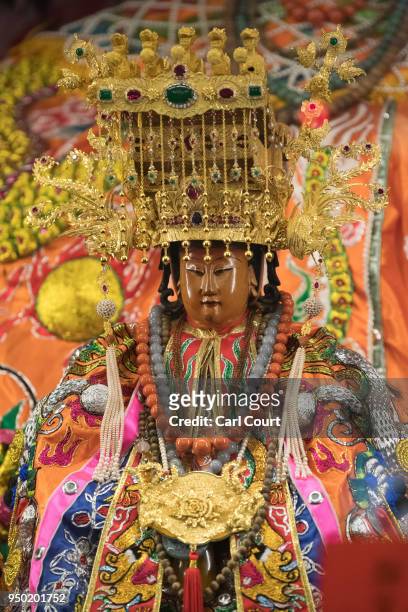 Statue of the goddess Mazu is displayed in Jenn Lann Temple following its return after being carried in a sedan chair on the nine day Mazu pilgrimage...