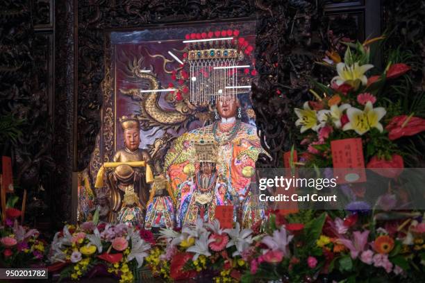 Statue of the goddess Mazu is displayed in Jenn Lann Temple following its return after being carried in a sedan chair on the nine day Mazu pilgrimage...