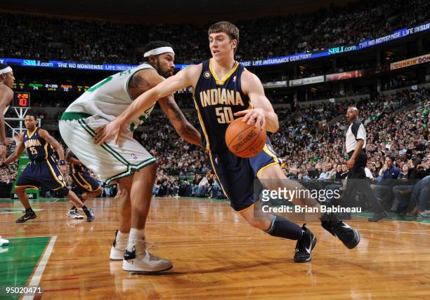 Tyler Hansbrough of the Indiana Pacers drives to the basket against Rasheed Wallace of the Boston Celtics on December 22, 2009 at the TD Garden in...