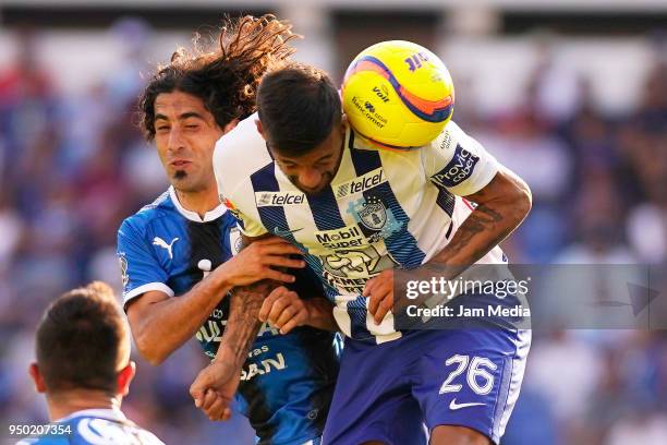 Matias Britos of Queretaro defends against Robert Herrera of Pachuca during the 16th round match between Queretaro and Pachuca as part of the Torneo...