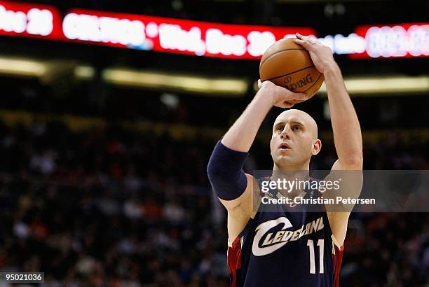 Zydrunas Ilgauskas of the Cleveland Cavaliers shoots a free throw shot during the NBA game against of the Phoenix Suns at US Airways Center on...