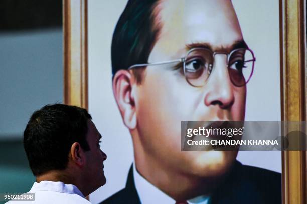 President of the Indian National Congress Party Rahul Gandhi pays tribute to Indian social reformer B.R. Ambedkar during the launch of the nationwide...