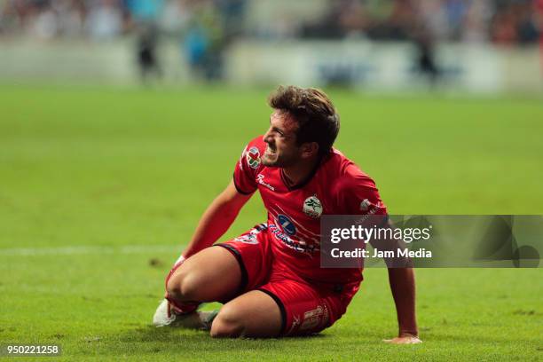 Pedro Aquino of Lobos BUAP lies on the grass during the 16th round match between Monterrey and Lobos BUAP as part of the Torneo Clausura 2018 Liga MX...