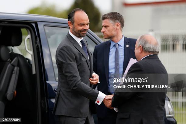 Thierry de La Tour d'Artaise, CEO of small domestic appliances and cookware Groupe Seb Moulinex, welcomes French Prime Minister Edouard Philippe at...
