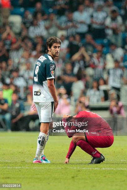 Lucas Albertengo of Monterrey observes Carlos Trevino of Lobos who laments his team's relegation to second division during the 16th round match...