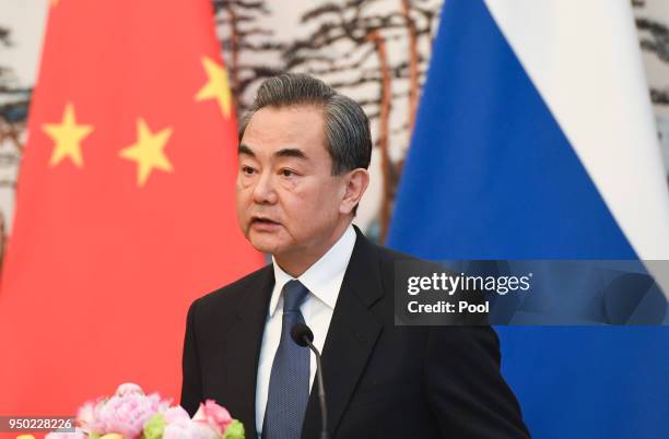 Chinese State Councilor and Foreign Minister Wang Yi speaks during his press conference with Russias Foreign Minister Sergei Lavrov at the Diaoyutai...