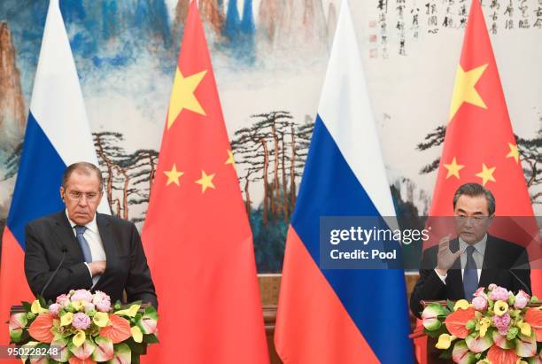 Chinese State Councilor and Foreign Minister Wang Yi speaks during his press conference with Russias Foreign Minister Sergei Lavrov at the Diaoyutai...