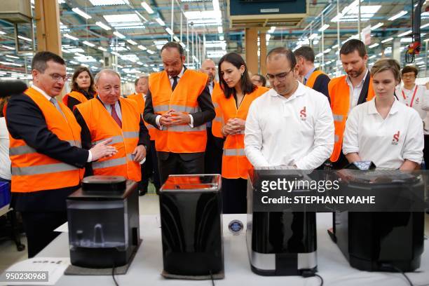 French Prime Minister Edouard Philippe , Thierry de la Tour d'Artaise, Chairman and CEO of French electrical goods company Groupe SEB and French...
