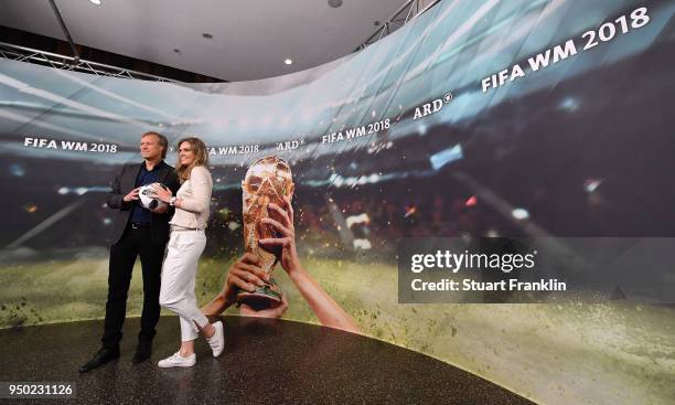 Gerhard Delling and Julia Scharf pose for a picture during the ARD and ZDF FIFA World Cup presenter team presentation on April 23, 2018 in Hamburg,...