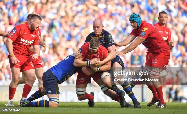 Dublin , Ireland - 21 April 2018; Lewis Rawlins of Scarlets is tackled by Jordi Murphy and Devin Toner of Leinster during the European Rugby...