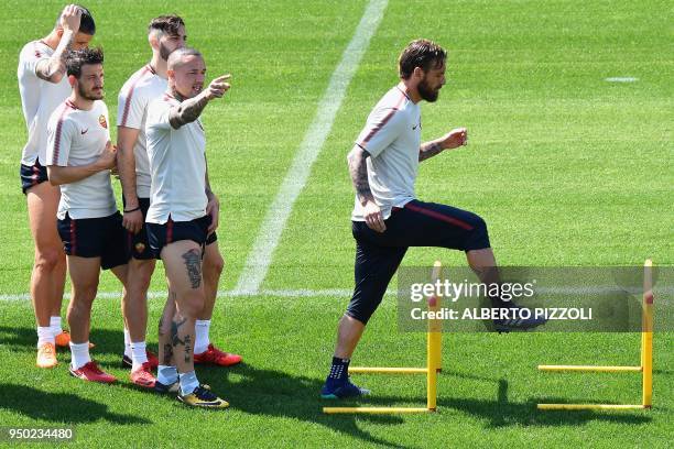 Roma's team players Greek defender Kostas Manolas, Italian midfielder Alessandro Florenzi, Serbian defender Aleksandar Kolarov, Belgian midfielder...