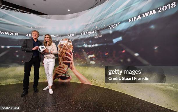 Gerhard Delling and Julia Scharf pose for a picture during the ARD and ZDF FIFA World Cup presenter team presentation on April 23, 2018 in Hamburg,...