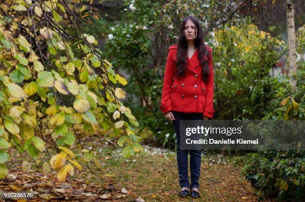 girl standing in garden, staring at camera, front view - katoomba falls stock pictures, royalty-free photos & images