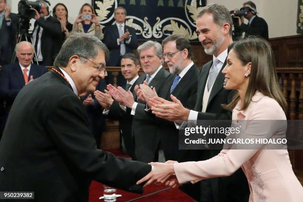 Nicaraguan writer Sergio Ramirez shakes hands with Queen Letizia after being awarded by Spain´s king Felipe VI with the 2017 Miguel de Cervantes...