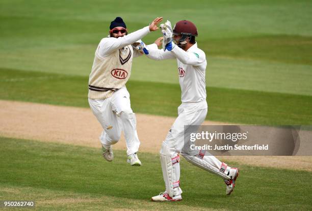 Amar Virdi of Surrey celebrates taking the wicket of Rilee Rossouw of Hampshire during the Specsavers County Championship: Division One match between...