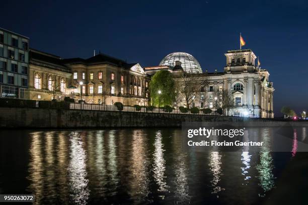 The Reichstag building is pictured during blue hour on April 19, 2018 in Berlin, Deutschland.