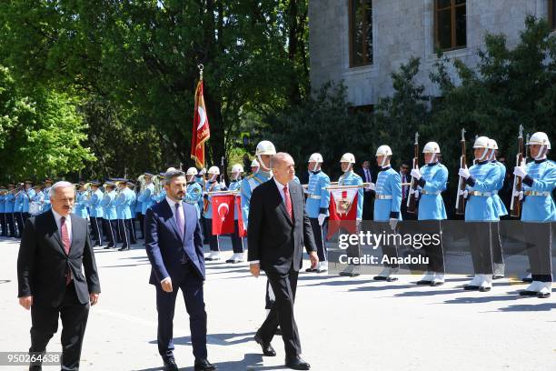 President of Turkey Recep Tayyip Erdogan walks past the honor guards as he arrives for a special session of parliament on the 98th anniversary of...