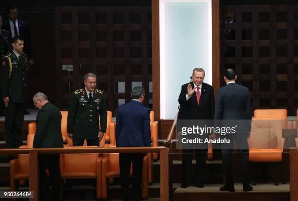 President of Turkey Recep Tayyip Erdogan greets the crowd as he arrives for a special session of parliament on the 98th anniversary of foundation of...