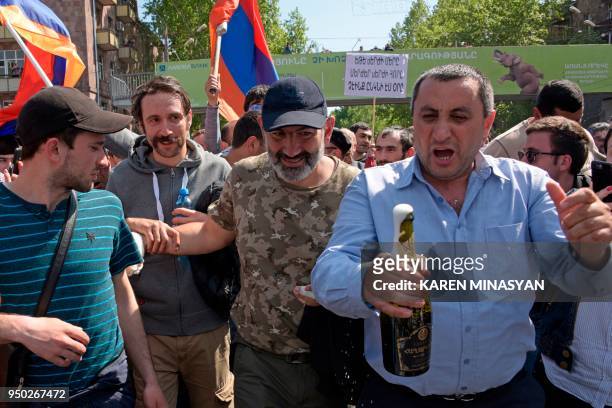 The leader of Armenia's mass anti-government protests Nikol Pashinyan meets with supporters upon his release in Yerevan on April 23, 2018. -...